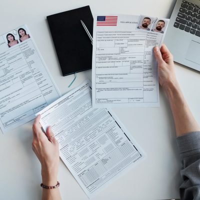 Checking Visa Application Papers At Office