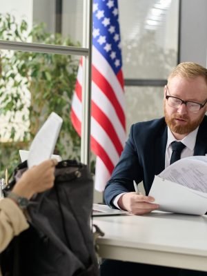 Young woman applying for visa in US immigration office
